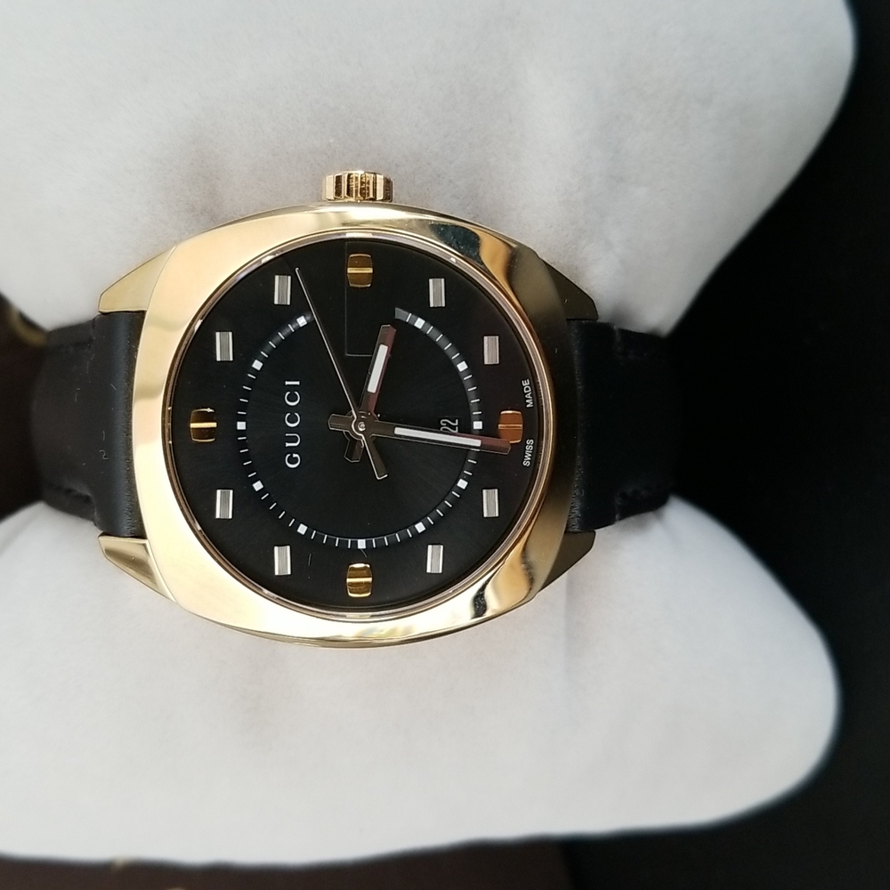 Gucci men watch.  New with tag and original box.